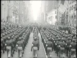 Returning soldiers march down New York City streets in a parade after World War II. News Clip