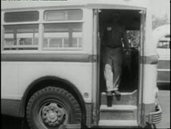 A man removes segregation signs from buses in Montgomery, Alabama. News Clip