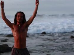 MS TD TU Rasta man spinning poi balls with ocean / Montezuma, Punteranes, Costa Rica Stock Footage