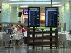 MS Interior cafe terrace with two departures schedules panels ahead / Lisbon, Portugal Stock Footage