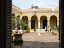 Trinidad Cuba interior courtyard with people and arches and beautiful architecture Stock Footage