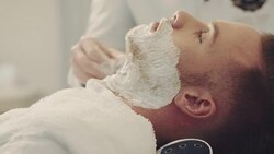 Barber preparing beard Stock Footage