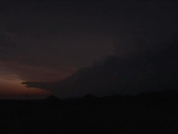Supercell storm at sunset with lightning, pan across storm, severe thunderstorm with lightning bolts, pretty, WA, USA Stock Footage