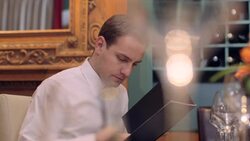 MS Young man looking at menu card in restaurant Stock Footage