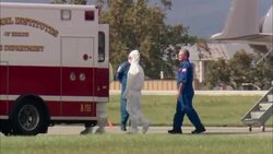 An American doctor exposed to Ebola in Sierra Leone has arrived near the nation's capital to be cared for at the National Institutes of Health. The doctor walked off a plane wearing a white protective suit and onto an NIH ambulance. (Sept. 28) News Clip