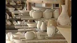 Man doing pottery in porcelain factory in China News Clip