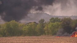 Two military-type vehicles were seen on fire and a third abandoned on Thursday in Berezove, a village along the main road connecting Mariupol and Donetsk, the largest rebel-held city in eastern Ukraine. (Sept. 4) News Clip