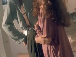 man reads romantic poem to woman inside urban loft apartment decorated with art pieces / Los Angeles, California, USA  Stock Footage