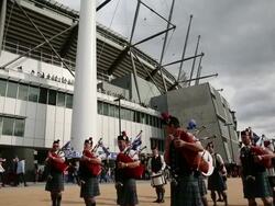 Tilted long shot of marching army band, dismissing Stock Footage
