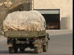 RUSHES: Syrian tank, trucks on road to Damascus News Clip