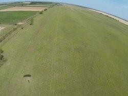 Parasailer lands in agricultural field Stock Footage