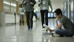 Young adult males bullying another student Stock Footage
