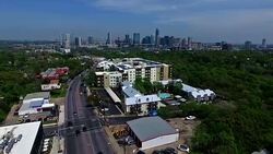 Aerial View Austin Texas 2016 Intersection and Condominiums on South Lamar Blvd with Skyline Cityscape Background Stock Footage