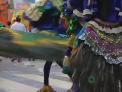 MS Dancers adorned with peacock feathers parade in Seenigama annual Perahern parade in Buddhist procession AUDIO / Sinigama, Southern Province, Sri Lanka Stock Footage