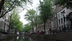 Floating on motorboat in Amsterdam Canals Stock Footage