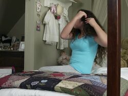 Slow motion of girl putting a barrette into her hair. Stock Footage