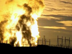 WS  Steam of power plant station rising behing rows of electricity pylons at sunrise / ARIZONA,United States   Stock Footage