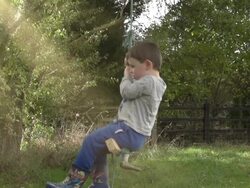 Little Boy On A Rope Swing In Slow Motion Stock Footage