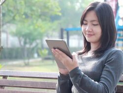 Tablet for lifestyle in playground,Bangkok Thailand Stock Footage