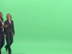 MS, Two businesswomen walking and talking in studio Stock Footage