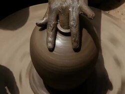 Man making a earthen pot on a pottery wheel  Stock Footage