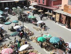 People shopping in a market square in Marrakech, Morocco, Africa Stock Footage