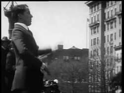 B/W 1910s Charlie Chaplin conducting with flair outdoors / World War I / newsreel Stock Footage