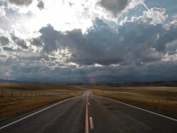 POV of empty Highway with dramatic clouds. Stock Footage