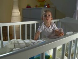 HD CRANE: Sleepless Baby Playing With Pacifier Stock Footage