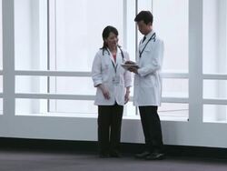  WS Doctors studying an electronic tablet then parting ways / Seattle, Washington, United States Stock Footage