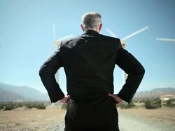 Rear view of businessman at wind farm Stock Footage