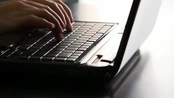 Female hands typing on a laptop keyboard Stock Footage