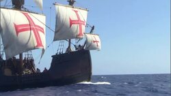 Sailors swarm over the deck of a ship as it sails the ocean. Stock Footage
