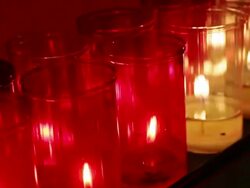 Candles burning inside a church Stock Footage