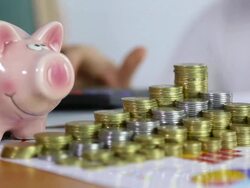 piggy bank and coins Stock Footage