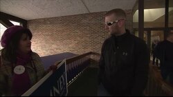 Republican supporters with Romney and Ron Paul placards News Clip