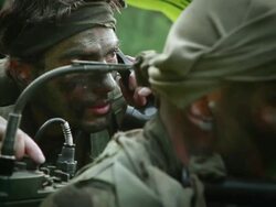 CU R/F U.S. Special Operation Forces radioman calling for helicopter support in Vietnam war / Jungle, Hue, Vietnam Stock Footage