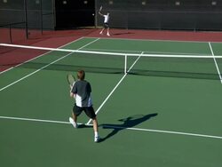 SLO MO, HA, WS, Two young men playing tennis, Santa Barbara, California, USA Stock Footage