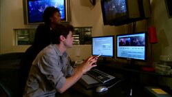 MS PAN ZO Female producer advising editor working at computer in studio/ New York, New York Stock Footage