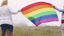 Two lesbian women on the top of the world Stock Footage