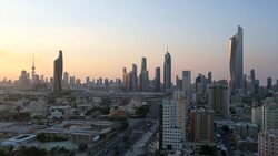 Kuwait, Kuwait City, elevated view over the modern city skyline at dusk Stock Footage