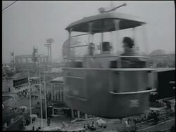 B/W 1964 cable car point of view wide shot of NY World's Fair / passes other cable car / Unisphere in background Stock Footage