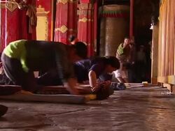 Pilgrims and monks at prayer in Jokhang Temple News Clip