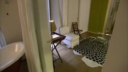 A sliding glass door closes by itself in a hotel room. Stock Footage