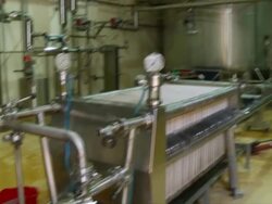 MS TD Shot of cooling pipes in brewery / Wau, Western Bahr el Ghazal, Sudan  Stock Footage