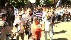 Protests as troika arrives to discuss austerity package Instructional Video