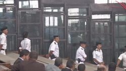 Egypt - Court refers death sentence on top Muslim Brotherhood leader and 13 others to grand cleric for religious opinion / At least three dead in bomb blast near foreign ministry in capital News Clip