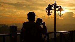Silhouette:photographer shooting landscape Stock Footage