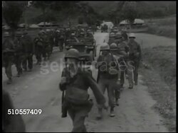 1950: KOREAN WAR: U.S. TROOPS MOBILIZING: LA WS U.S. Soldiers walking across bridge. LS Soldiers, military jeeps on road. WS Trucks loaded w/ soldiers over bridge. MS U.S. tanks moving. WS South Korean (unconfirmed) tanks down road. Instructional Video