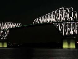 MS View of lit Tokyo Gate Bridge at Twilight / Wakasu, Tokyo, Japan Stock Footage